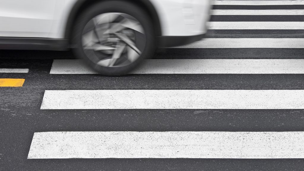 Current image: Car speeding over crosswalk